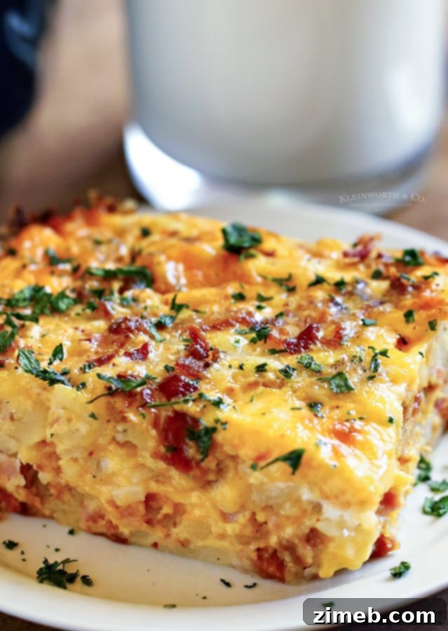 This super easy Hashbrown Breakfast Casserole is made with milk, eggs, butter, sausage, bacon, hash browns, and cheese. What a great start to the day!
