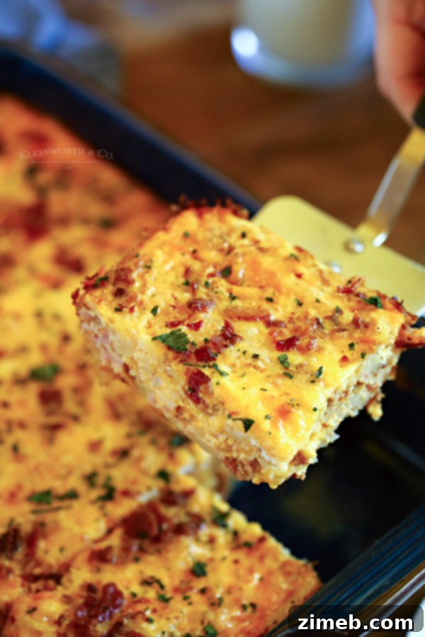 This super easy Hashbrown Breakfast Casserole is made with milk, eggs, butter, sausage, bacon, hash browns, and cheese. What a great start to the day!