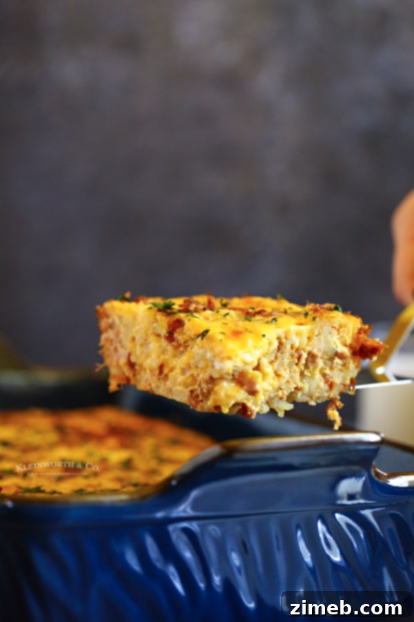 This super easy Hashbrown Breakfast Casserole is made with milk, eggs, butter, sausage, bacon, hash browns, and cheese. What a great start to the day!