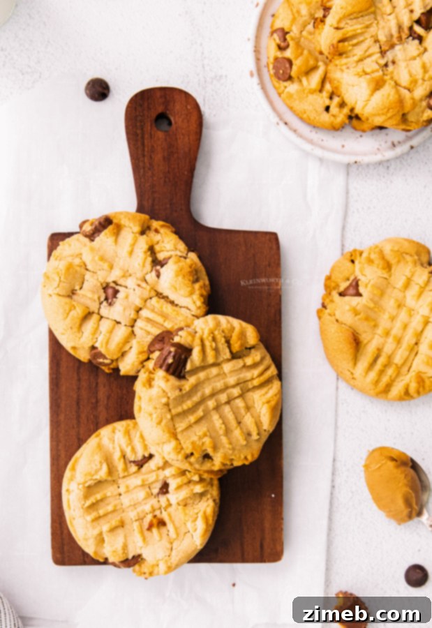 Peanut Butter Cup Stuffed Cookies 5 Easy Reese's cookies on a cooling rack, showcasing their perfect shape and enticing texture.