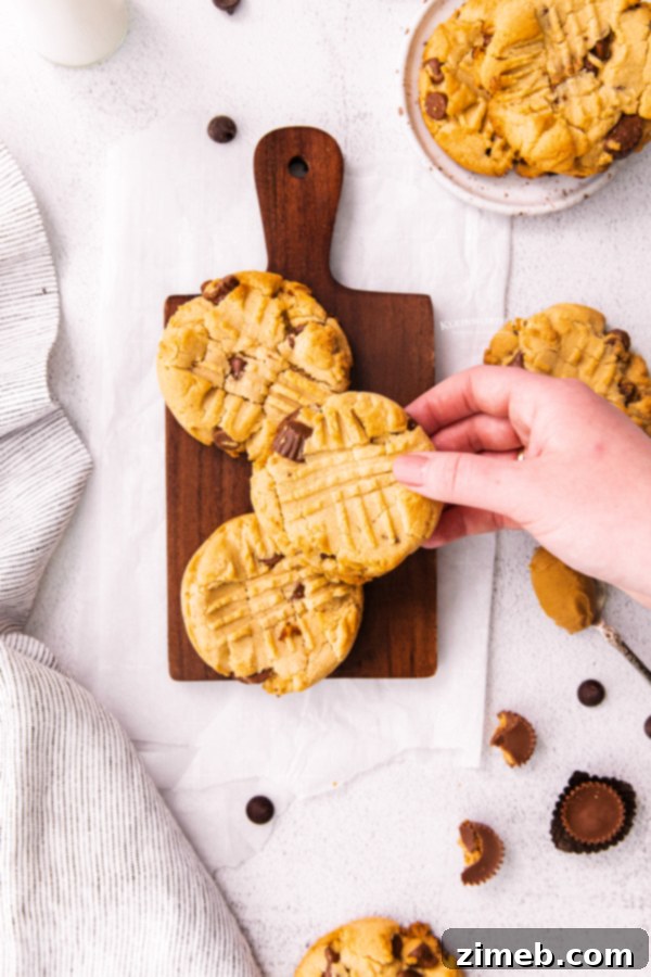 Peanut Butter Cup Stuffed Cookies 9 Reese's cookies with peanut butter cups, baked to perfection and stacked.