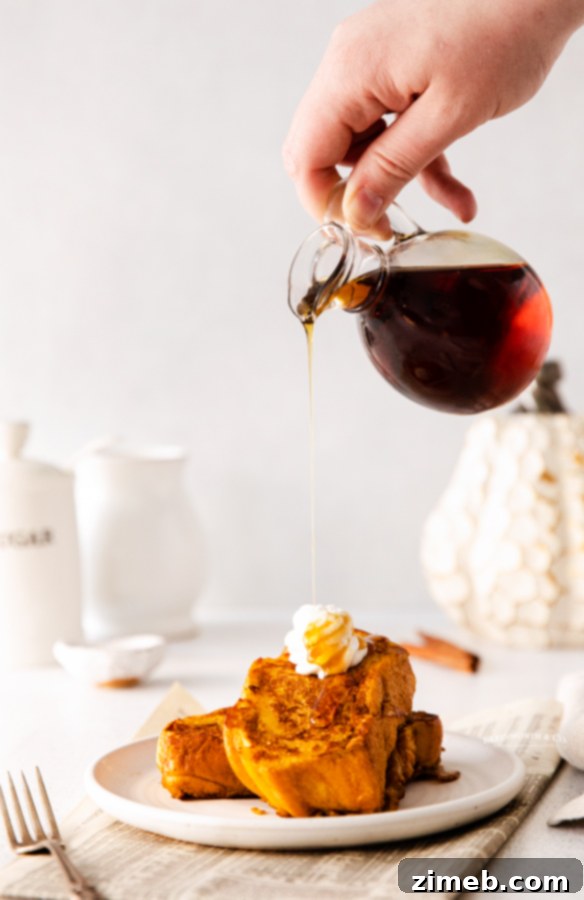 Adding maple syrup to a stack of Pumpkin French Toast