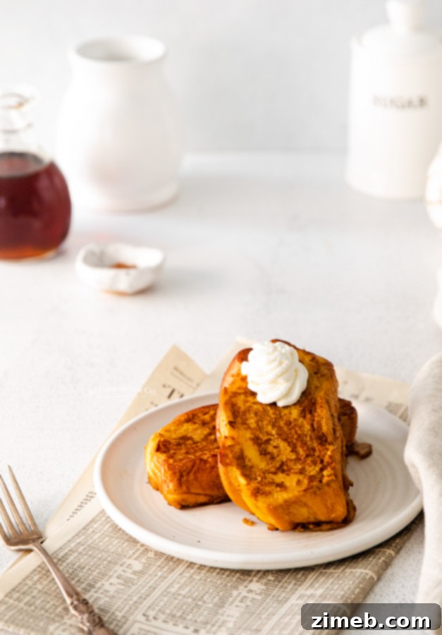 Beautifully plated morning fall food, Pumpkin French Toast with berries and maple syrup