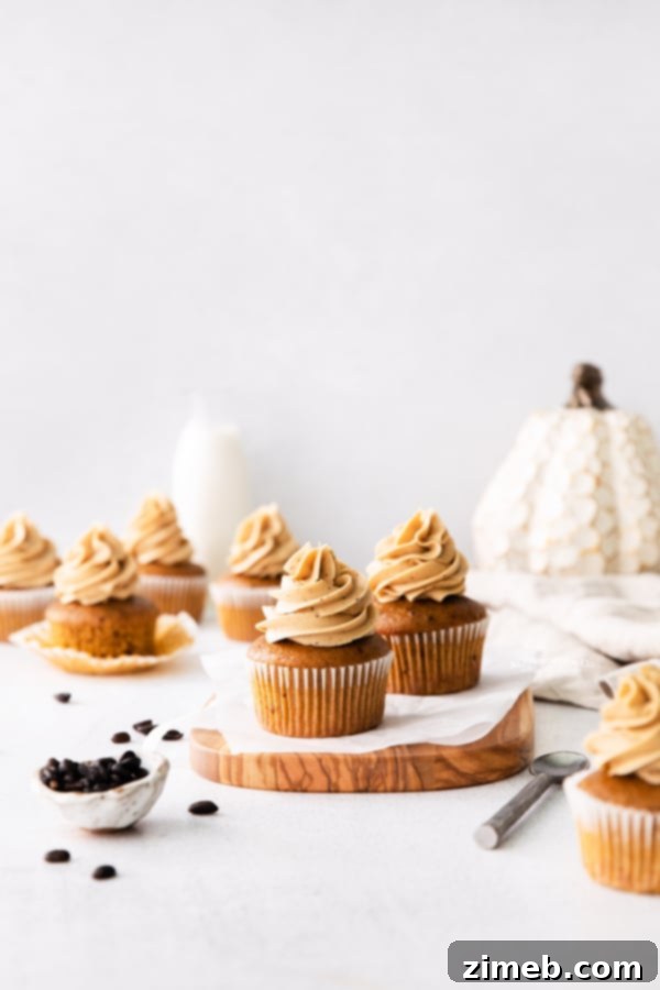 Fall cupcakes with pumpkin decorations, perfect for seasonal gatherings