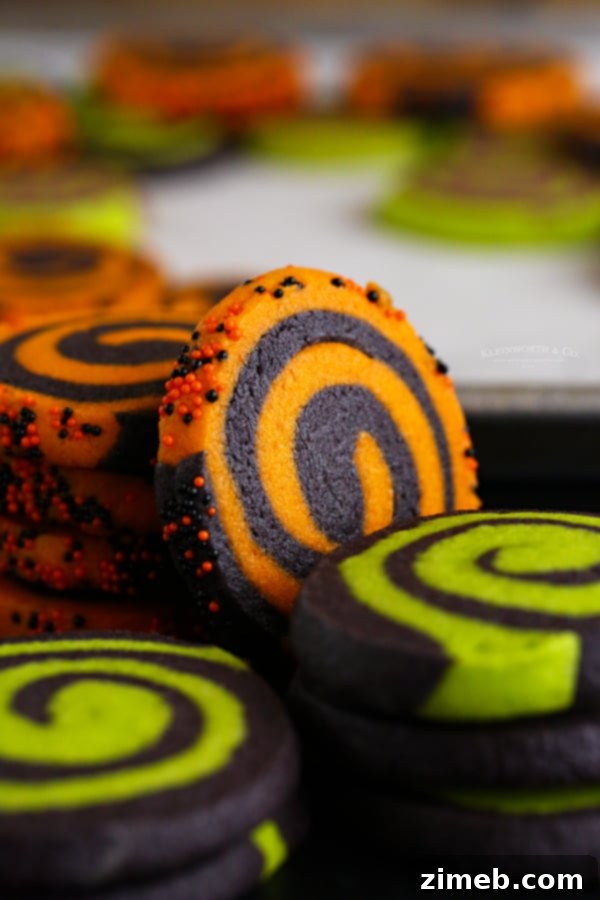 Wickedly Delicious Halloween Cookies 5 Festive pinwheel cookies arranged for a Halloween party