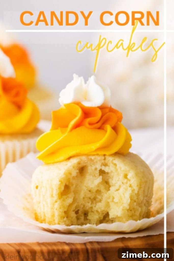 Harvest Harmony Cupcakes 2 Festive Candy Corn Cupcakes topped with colorful vanilla buttercream, perfect for Halloween parties.