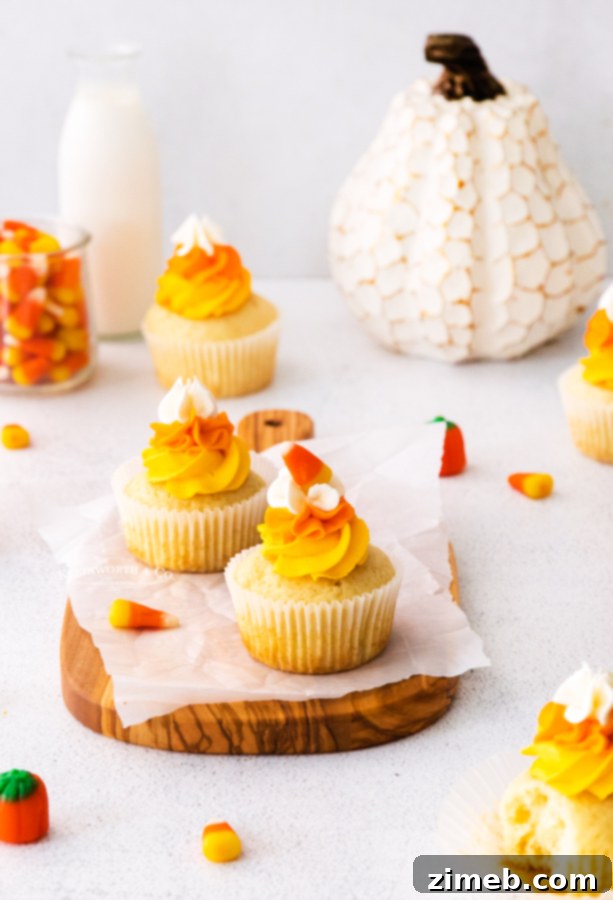 Harvest Harmony Cupcakes 25 Candy corn dessert with vibrant colors.