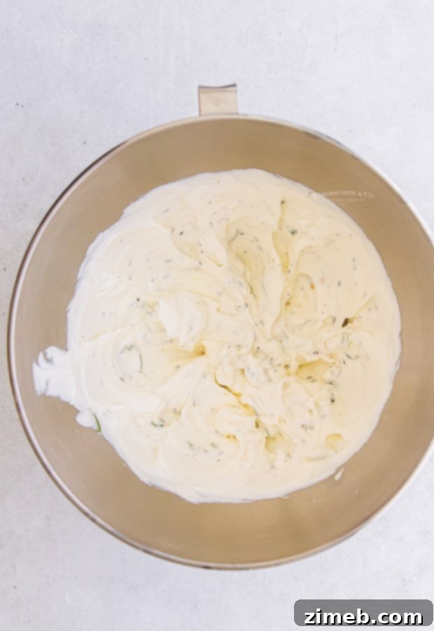 How to Make Everything Bagel Dip - Step-by-step assembly of the dip.