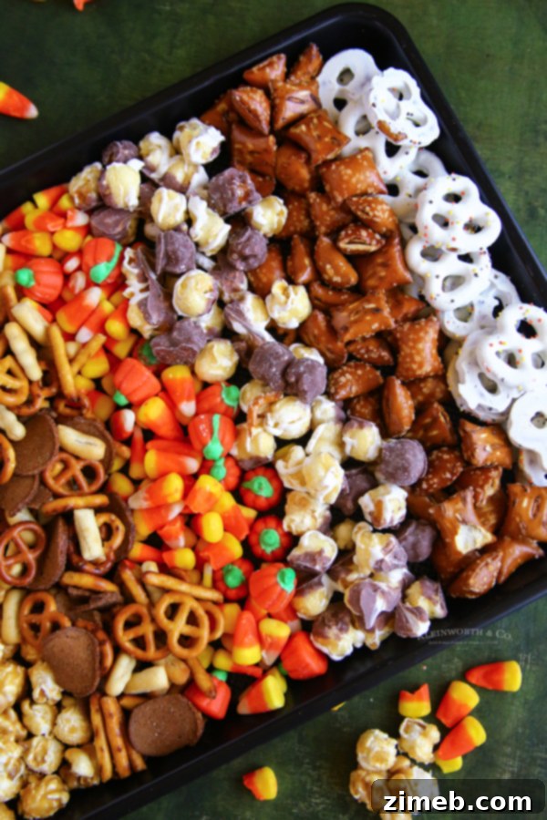 Monster Munch Mix 5 Recipe for Halloween Snack Mix - Ingredients spread out on a baking sheet.