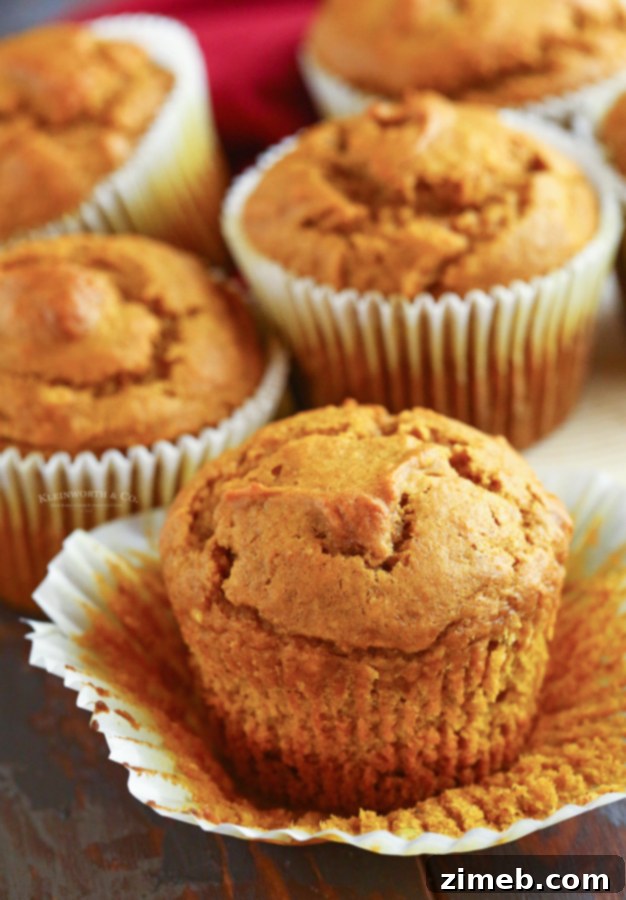 Freshly baked jumbo pumpkin muffins, perfect for a fall breakfast.