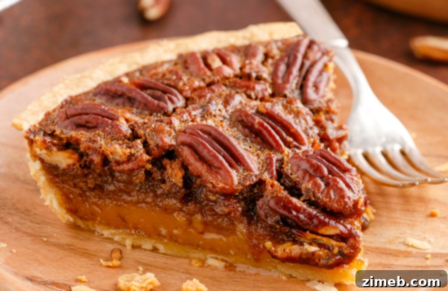 Foolproof Pecan Pie 4 slice of holiday Pecan Pie, showing the rich filling