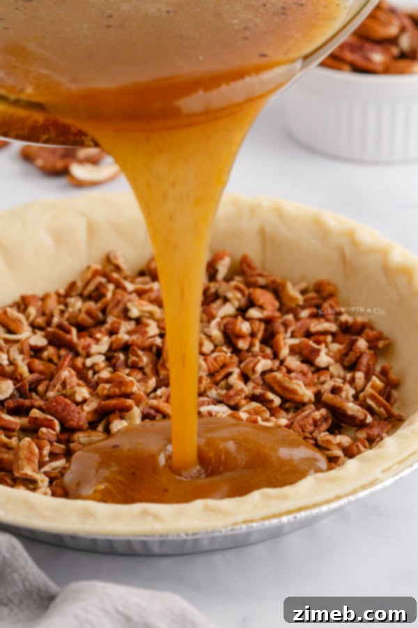 Foolproof Pecan Pie 9 pouring the filling into the pie crust for a perfect pecan pie