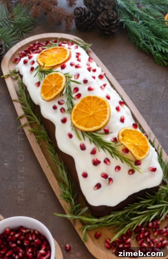 Spiced Ginger Delight 4 Close-up of a Spiced Gingerbread Cake loaf, beautifully decorated with fresh orange slices, ready for a holiday dessert.