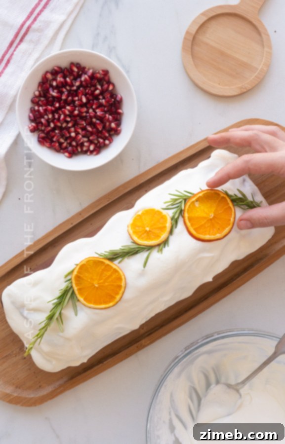 Spiced Ginger Delight 9 Decorating a moist Gingerbread Loaf Cake with fresh orange slices, adding a vibrant and festive touch.
