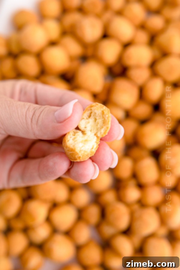 Cross-section of cooked Struffoli dough balls, showing their light interior