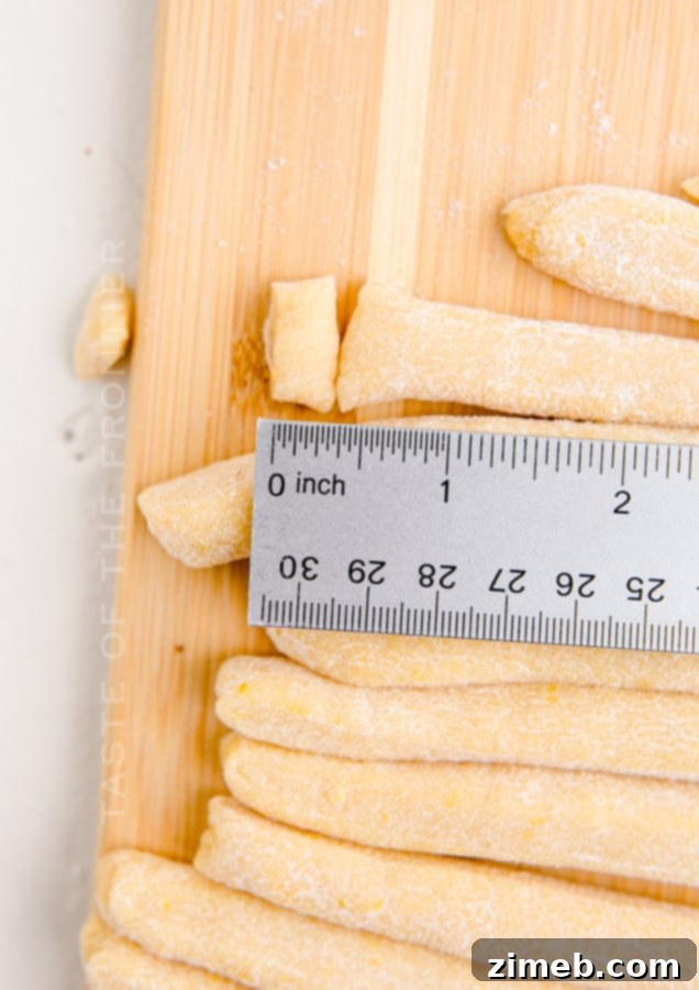 Close-up of marble-sized Struffoli dough pieces, ready for frying