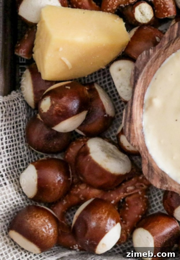 Warm soft pretzels ready for dipping in creamy homemade cheese sauce