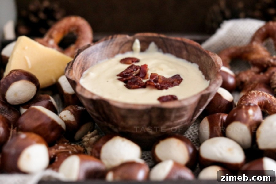 Appetizer pretzel dip, warm and creamy, ready for serving