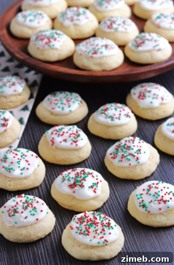 Melt-in-Your-Mouth Ricotta Delights 4 A tray of holiday Italian Ricotta Cookies, beautifully decorated with sprinkles, embodying festive warmth and traditional charm.