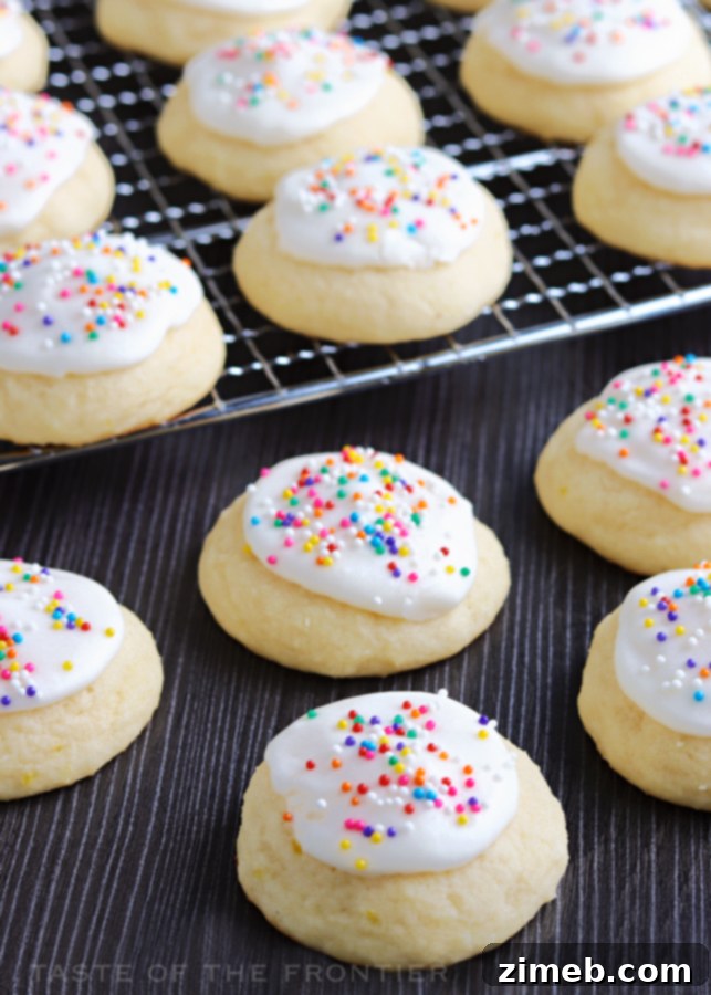 Melt-in-Your-Mouth Ricotta Delights 5 Vibrant Rainbow Lemon Ricotta Cookies, artfully decorated with colorful sprinkles, promising a burst of flavor and festive cheer.