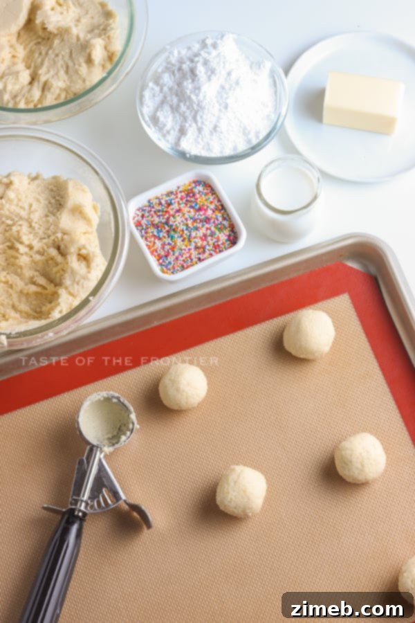 Melt-in-Your-Mouth Ricotta Delights 8 Hands rolling dough into balls for Ricotta Cookies, a key step in preparing these delicious Italian treats.