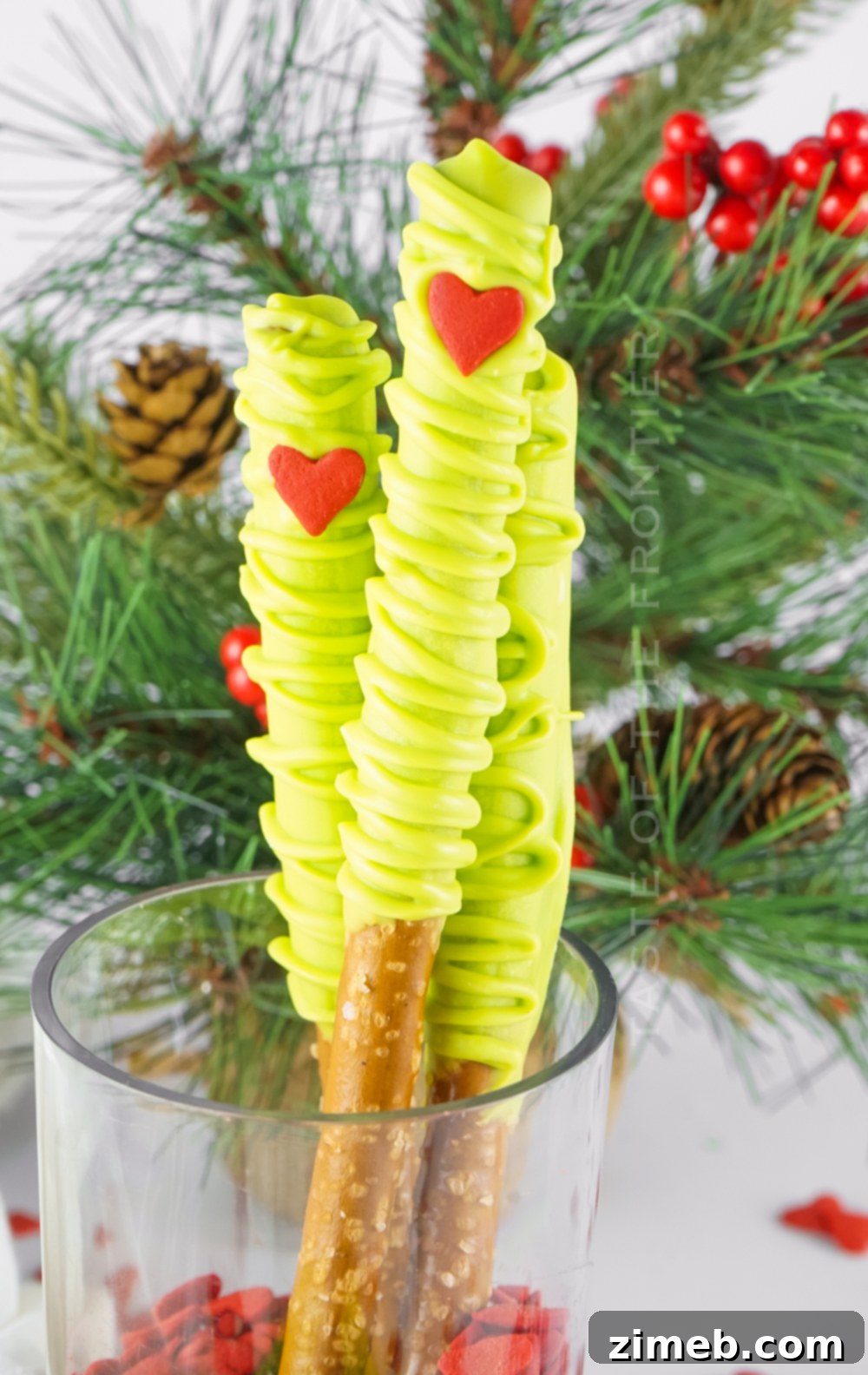 Grinch's Heart-Melting Pretzel Delights 2 Festive Grinch Chocolate Covered Pretzel Rods for holiday snacking