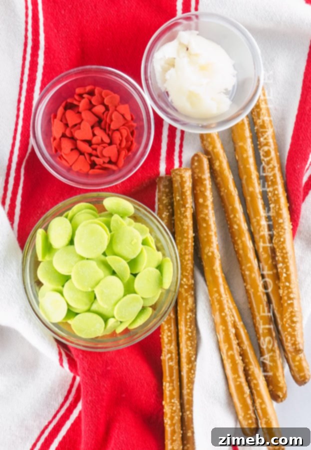Grinch's Heart-Melting Pretzel Delights 6 Ingredients laid out for making Grinch Chocolate Covered Pretzel Rods
