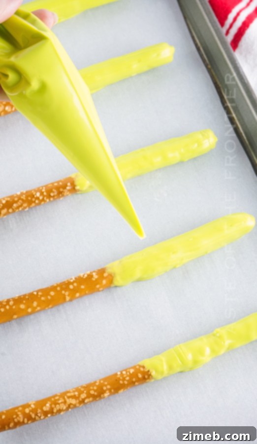 Grinch's Heart-Melting Pretzel Delights 8 How to make Grinch Chocolate Covered Pretzel Rods step by step