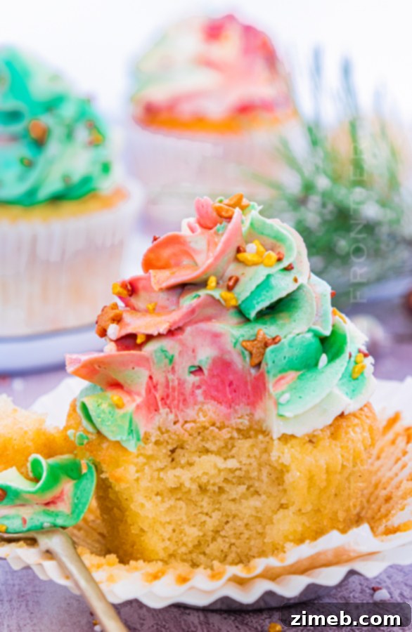 A delicious bite taken out of a Christmas cupcake
