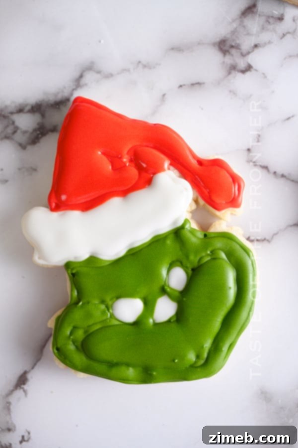 Grinch's Heart-Melting Cookies 9 adding the royal icing to Grinch Cookies