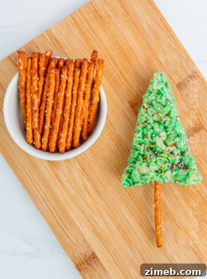 Yuletide Crispy Delights 11 Adding a pretzel stick to a Christmas Rice Krispie Treat