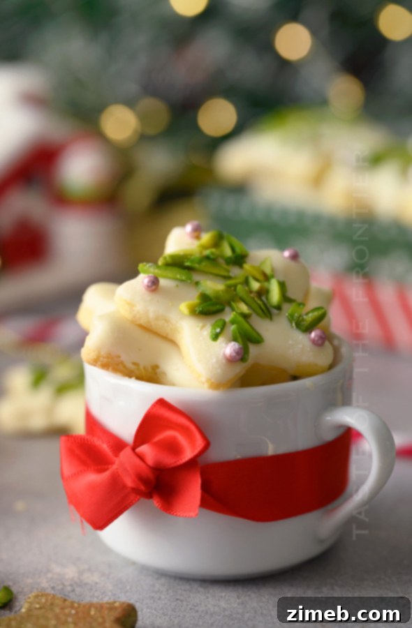 A cup filled with festive Christmas Pistachio Cookies