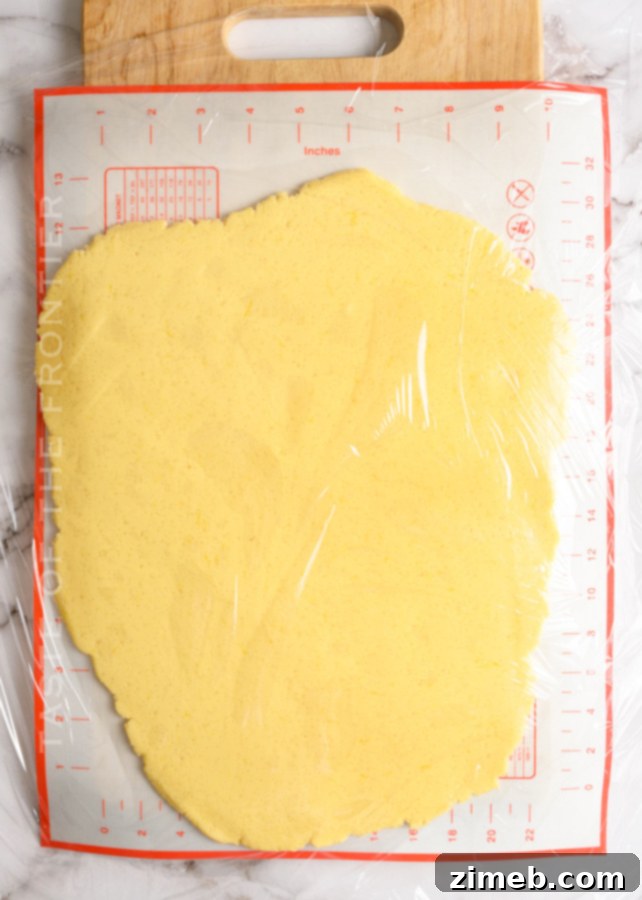 Rolling cookie dough for cutting into perfect shapes for gifting