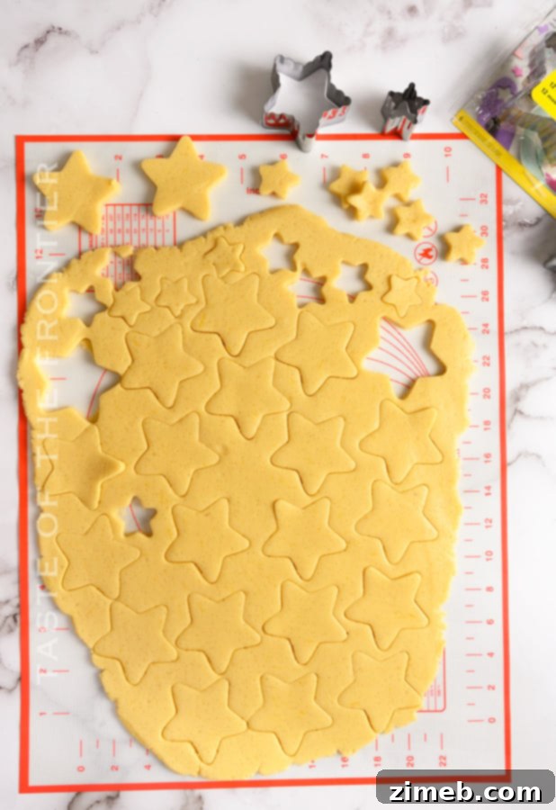 Cutting star cookies from the dough, perfect for cute Christmas treats