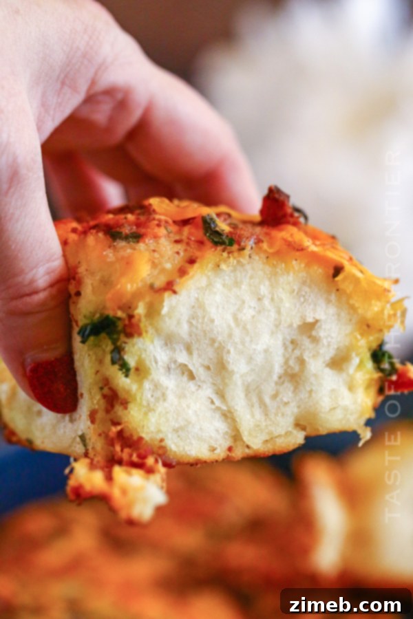 Recipe for One Hour Disappearing Fat Rolls, showing a close-up of cheesy, bacon-topped rolls