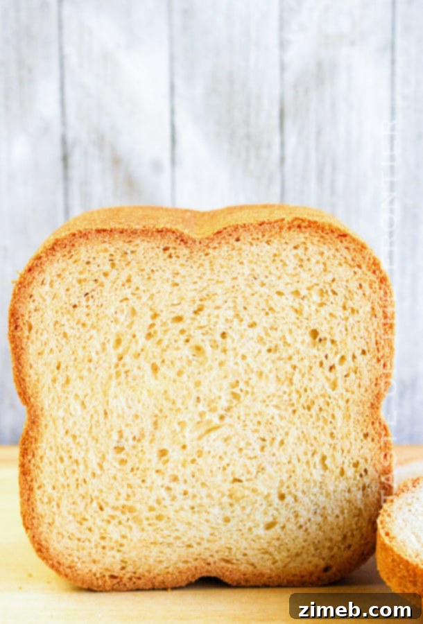 Perfect Bread Machine White Bread 3 Perfectly sliced bread machine white bread, ready for sandwiches.