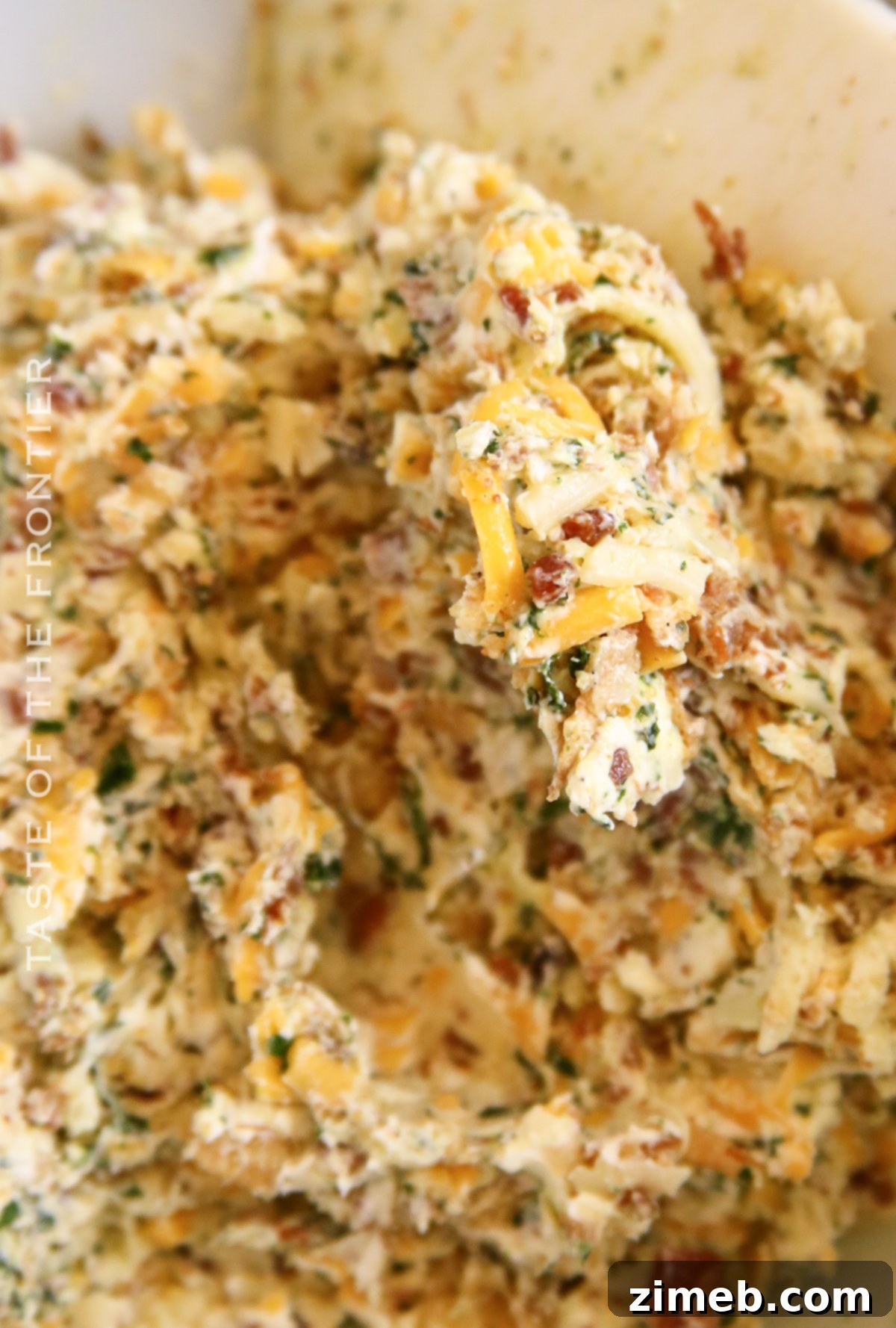 mixing bacon cheddar ranch cheese log