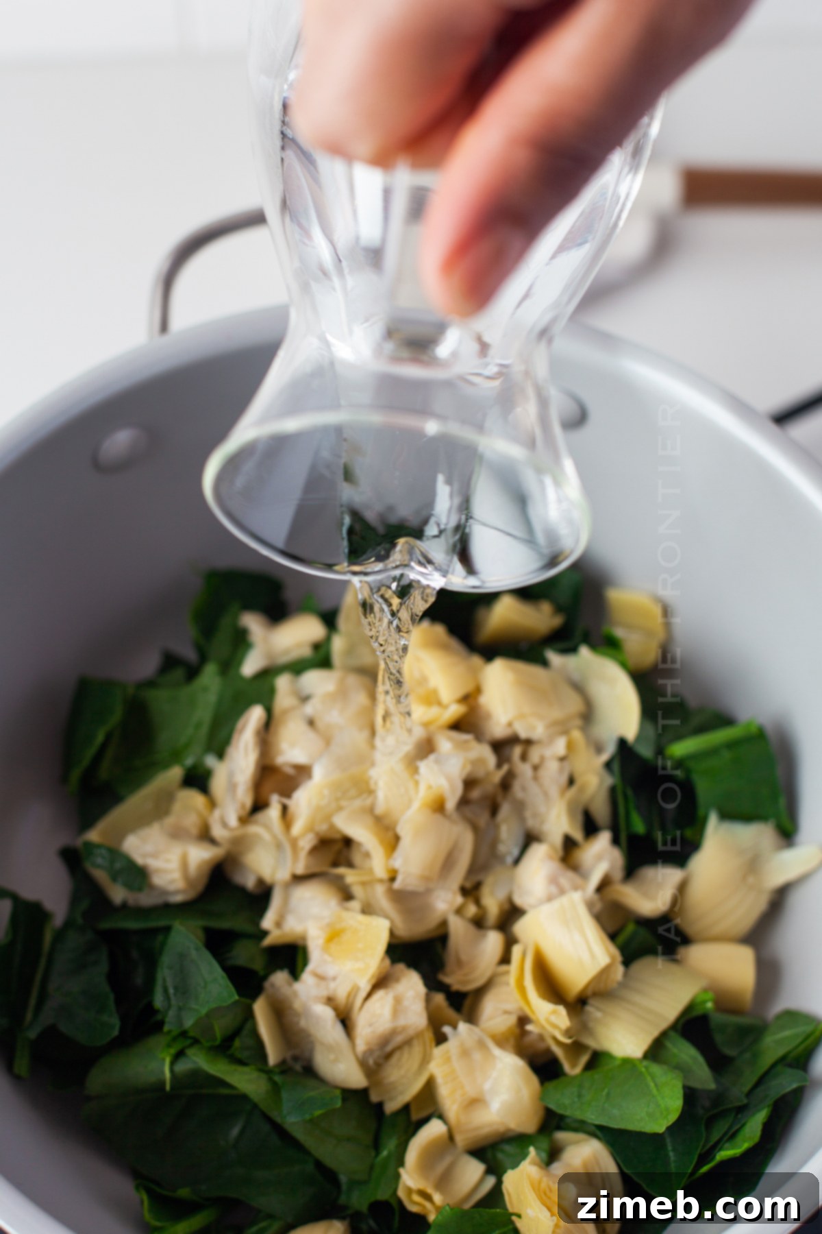 Creamy Spinach Artichoke Stuffed Mushrooms 6 add the water - artichoke mixture
