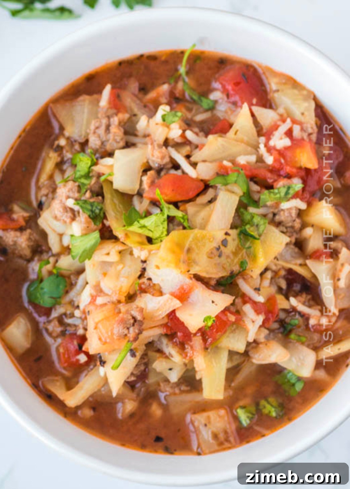 Stuffed Cabbage Soup 2 Hearty Unstuffed Cabbage Roll Soup in a rustic bowl, perfect for a cozy dinner.