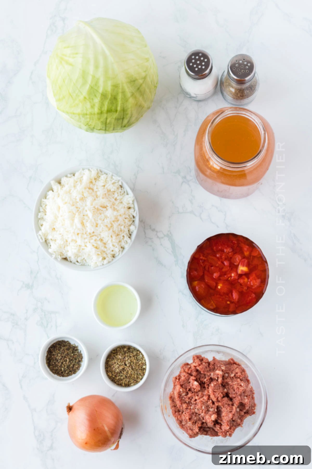 Stuffed Cabbage Soup 5 Fresh ingredients laid out for making Cabbage Roll Soup, including ground beef, cabbage, and tomatoes.