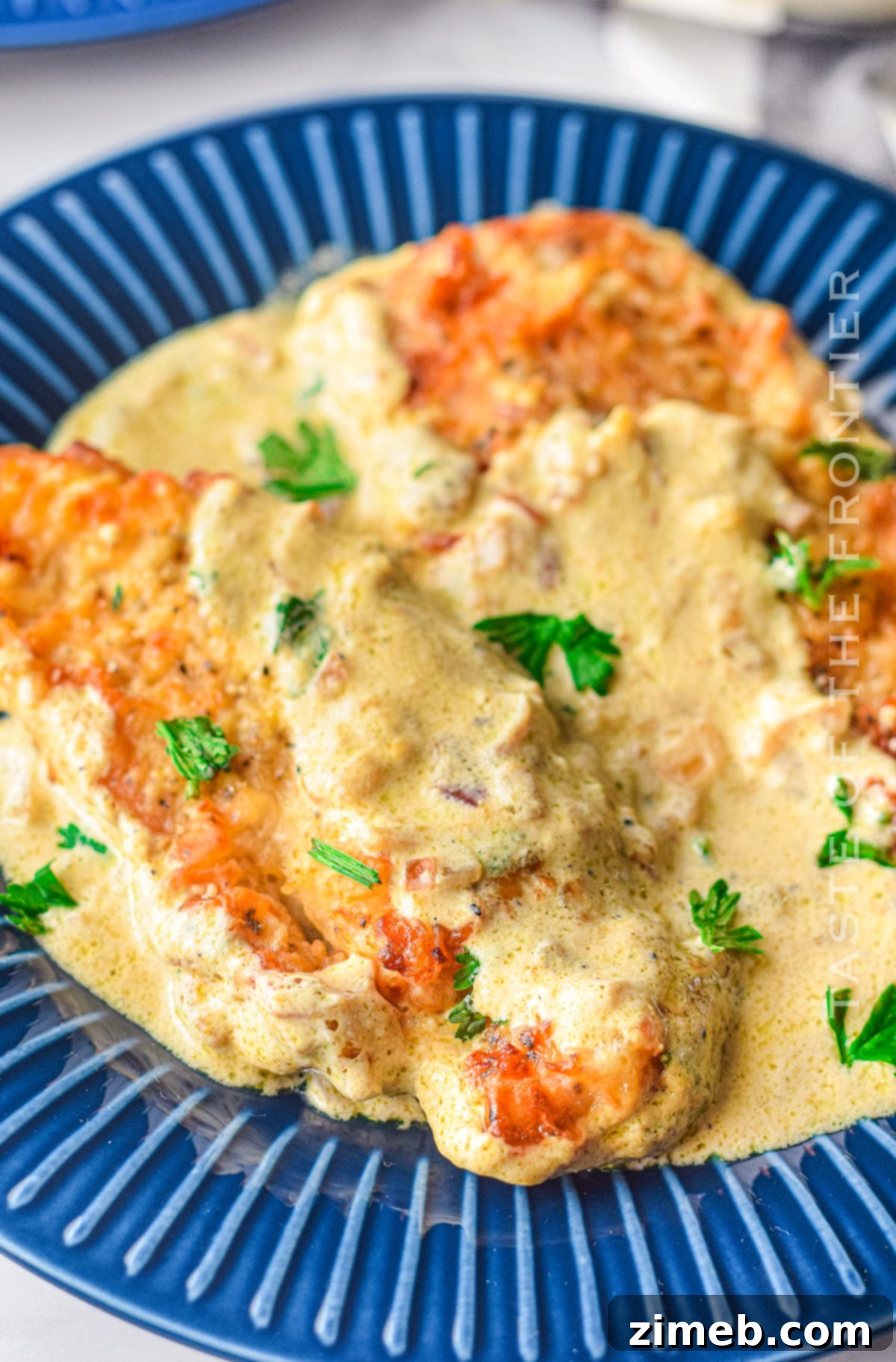 Dreamy Creamy Air Fryer Garlic Chicken 2 Air Fryer Creamy Garlic Chicken, ready to serve in a skillet.