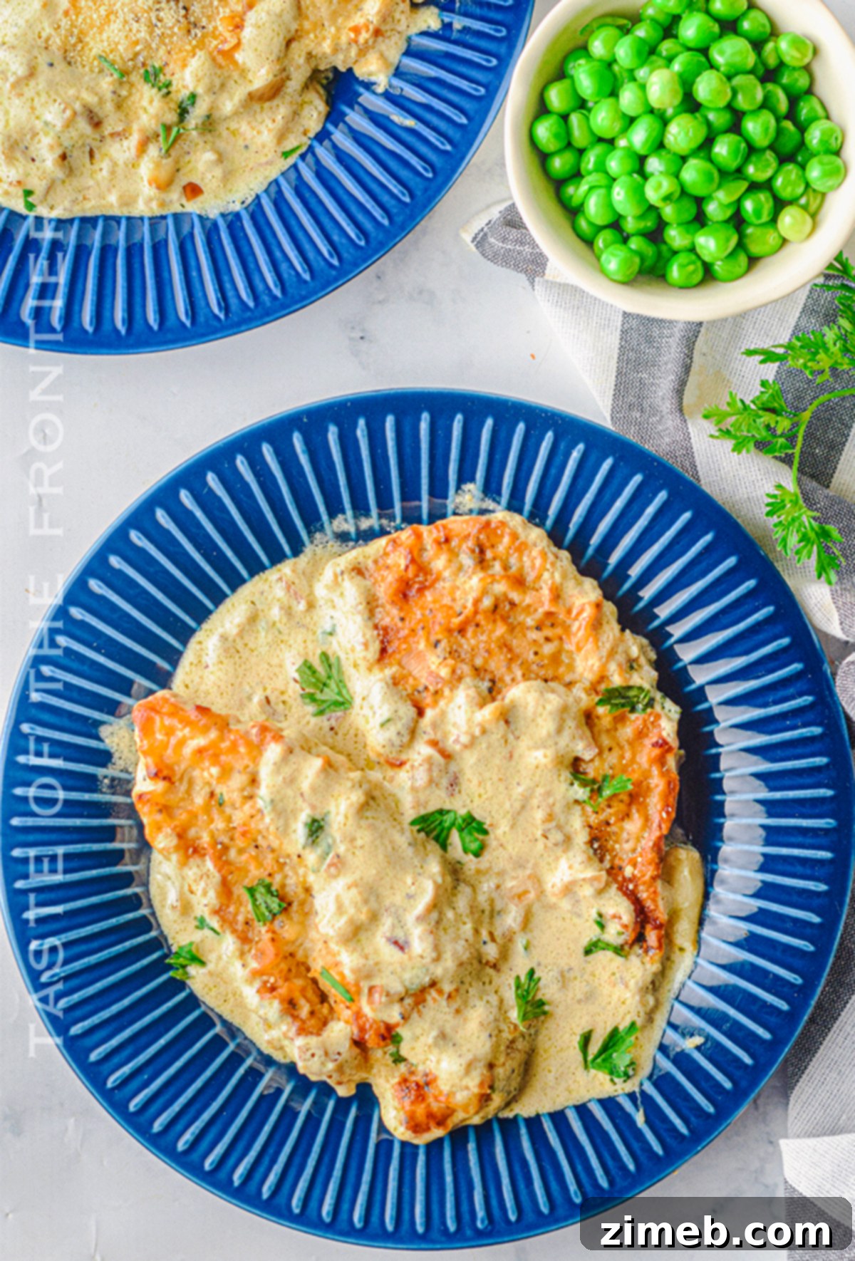 Dreamy Creamy Air Fryer Garlic Chicken 21 Close-up of air-fried chicken coated in rich creamy sauce.
