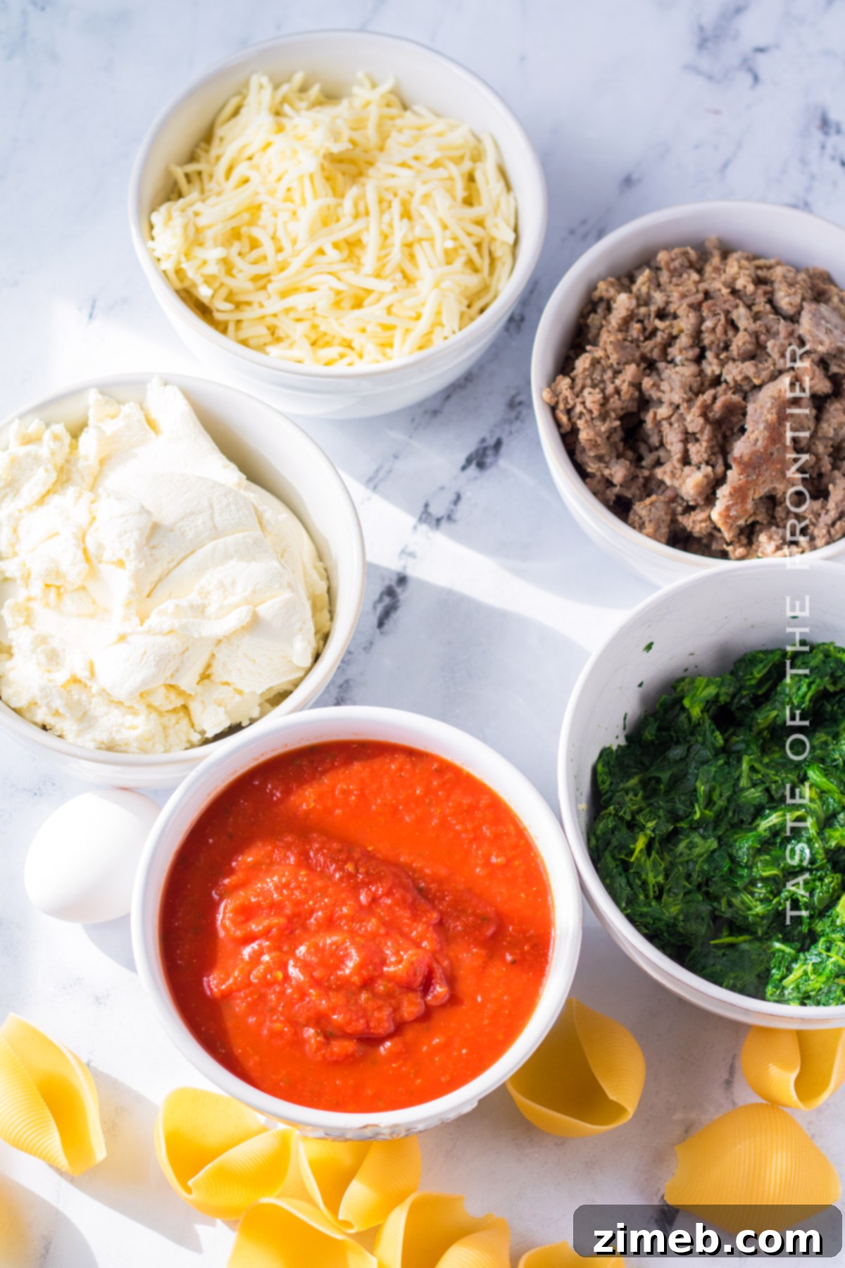 Set It and Forget It Stuffed Shells 4 Ingredients for slow cooker stuffed shells laid out on a table