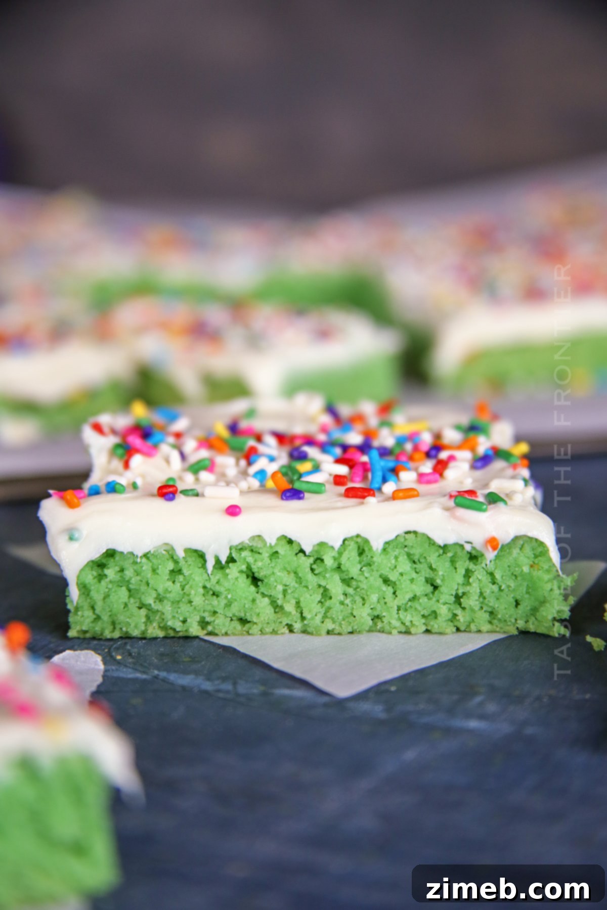 Lucky St Patricks Day Cake Mix Cookie Bars 19 Green cake mix cookie bars with frosting and sprinkles.