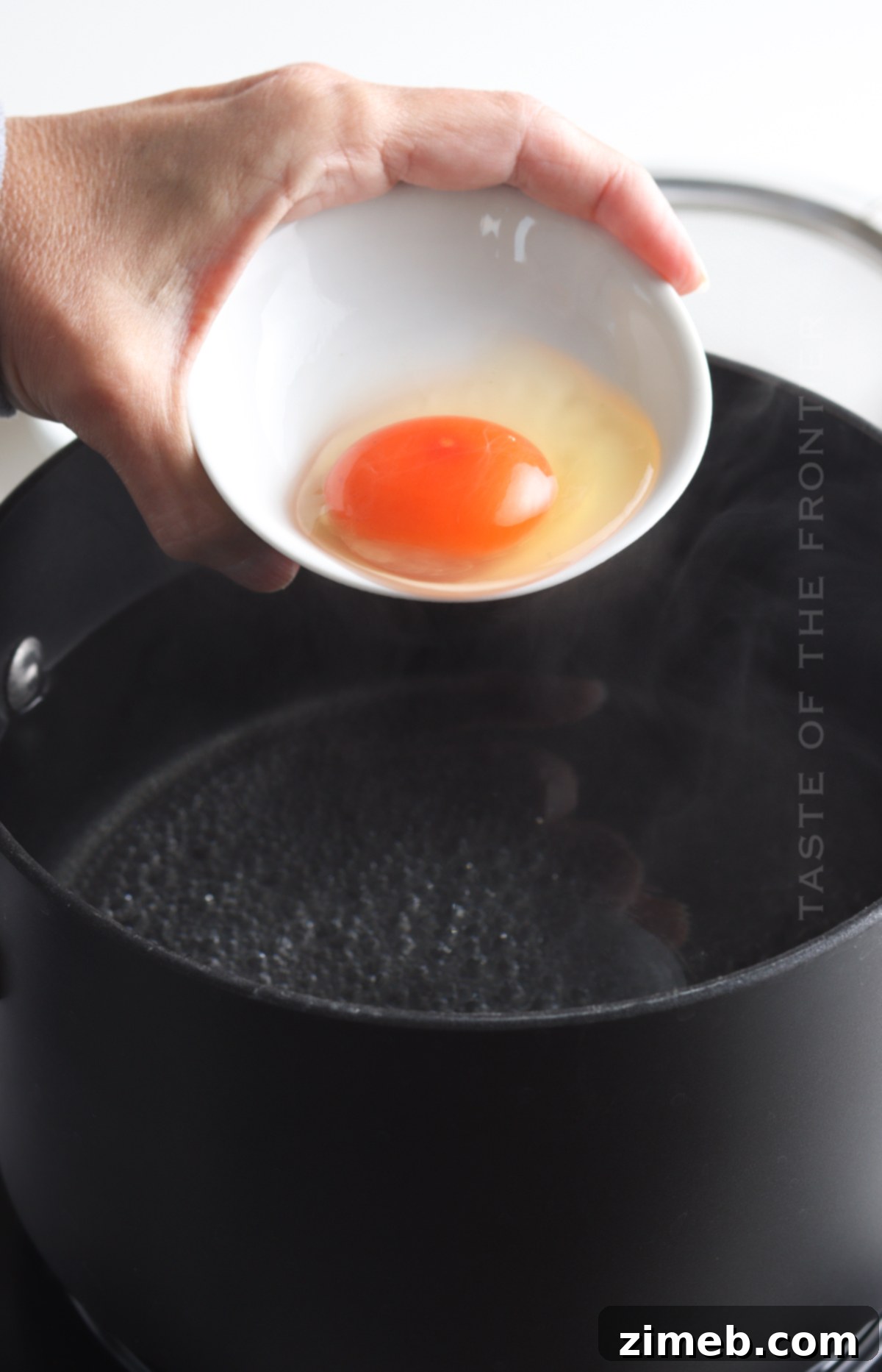 Foolproof Poached Eggs 7 dropping the egg in the water