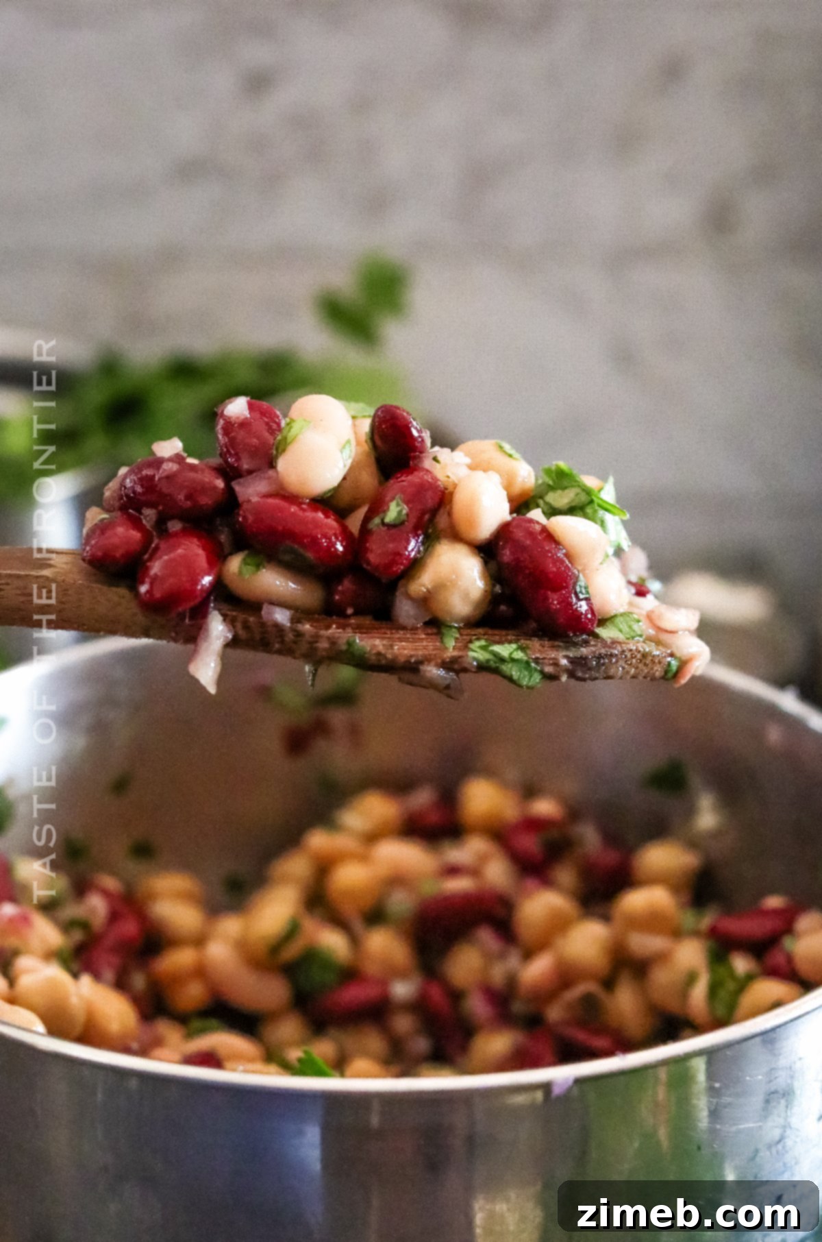 Three types of beans mixed together, highlighting the primary ingredients of the salad.