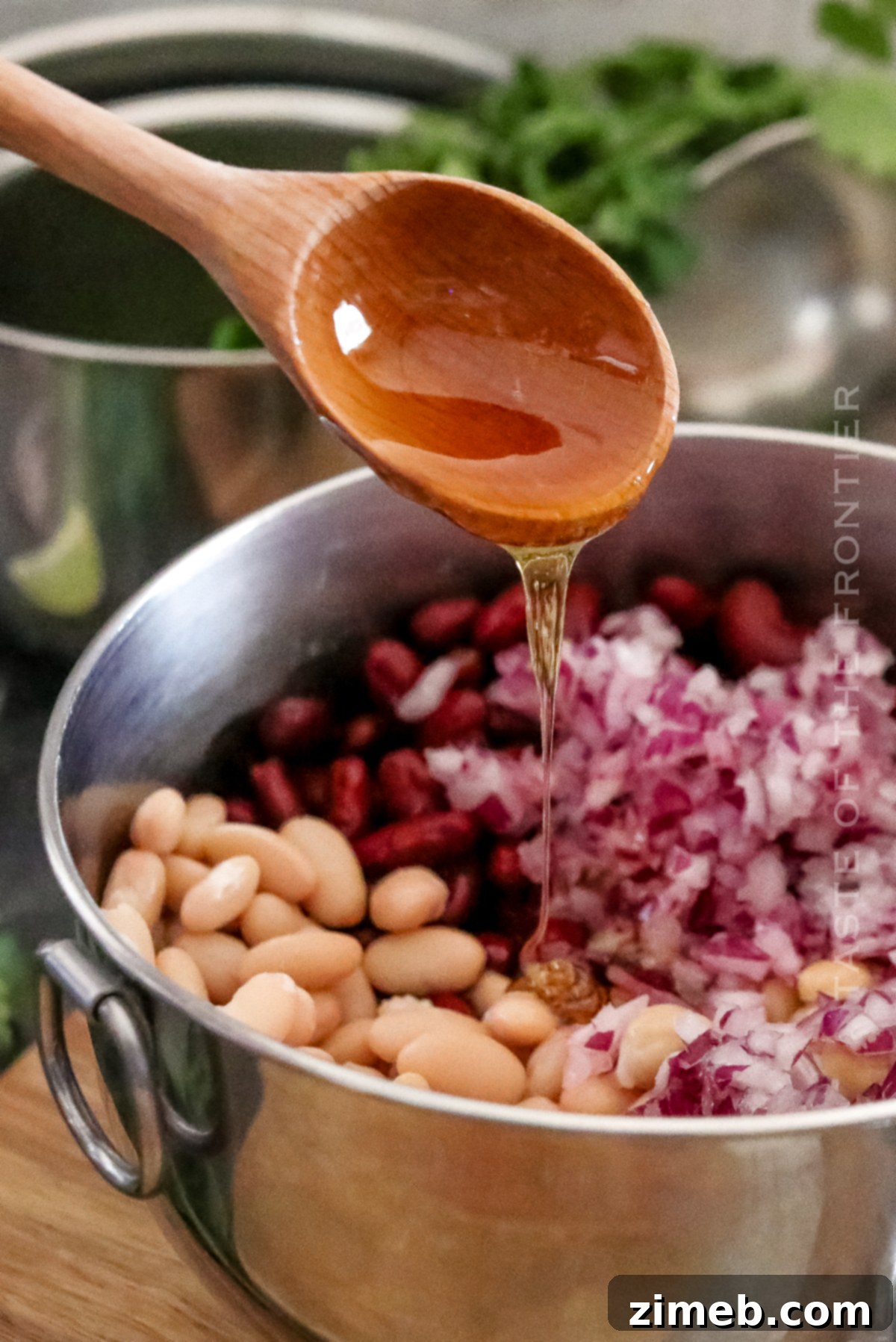 A full bowl of a flavorful recipe for Three Bean Salad, garnished and ready to serve.