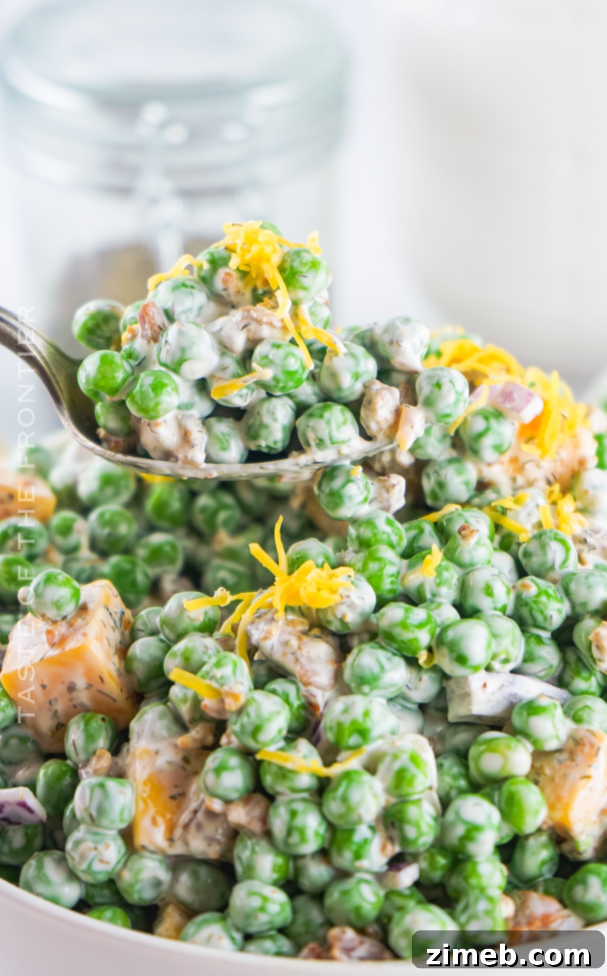 Refreshing Pea Salad 20 Green Pea Salad presented as a perfect BBQ side dish on a picnic table.