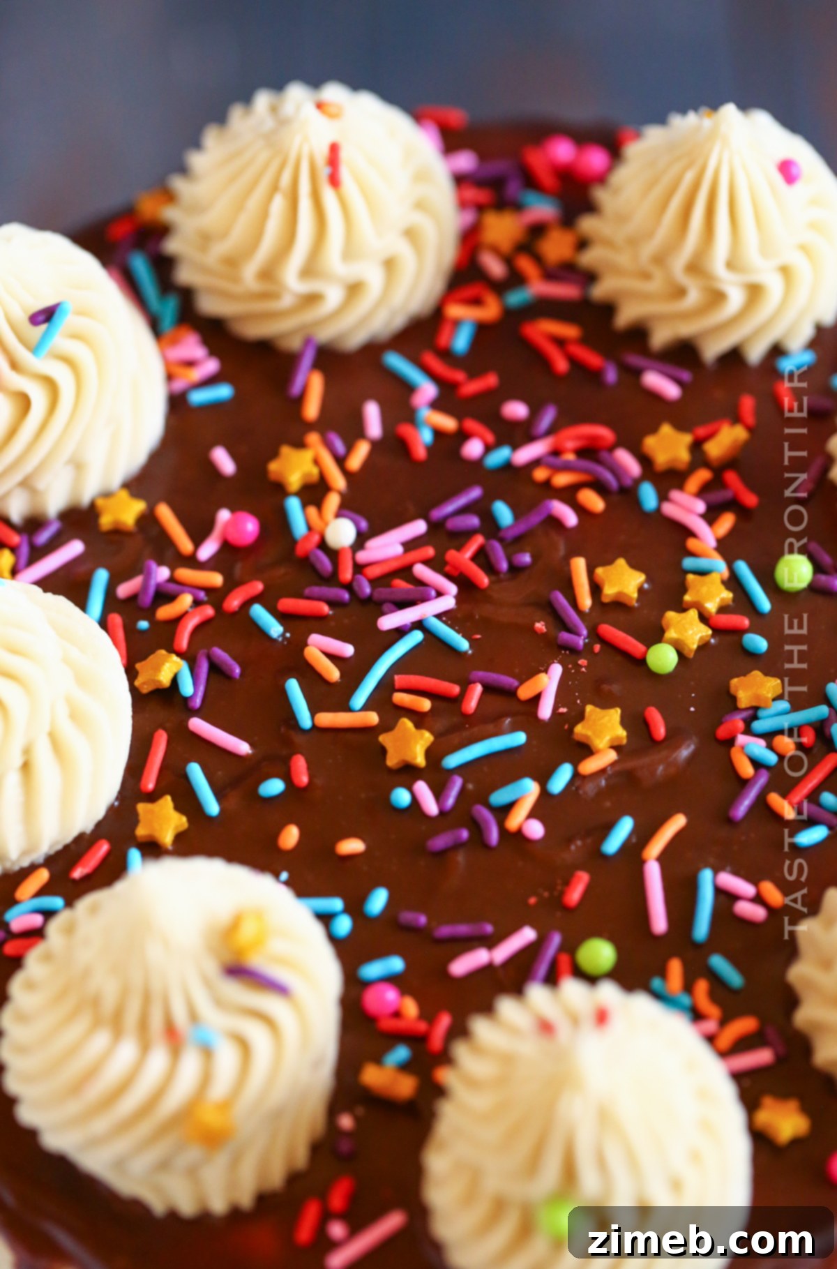 A stunning easy drip cake recipe with rich chocolate ganache cascading down the sides.