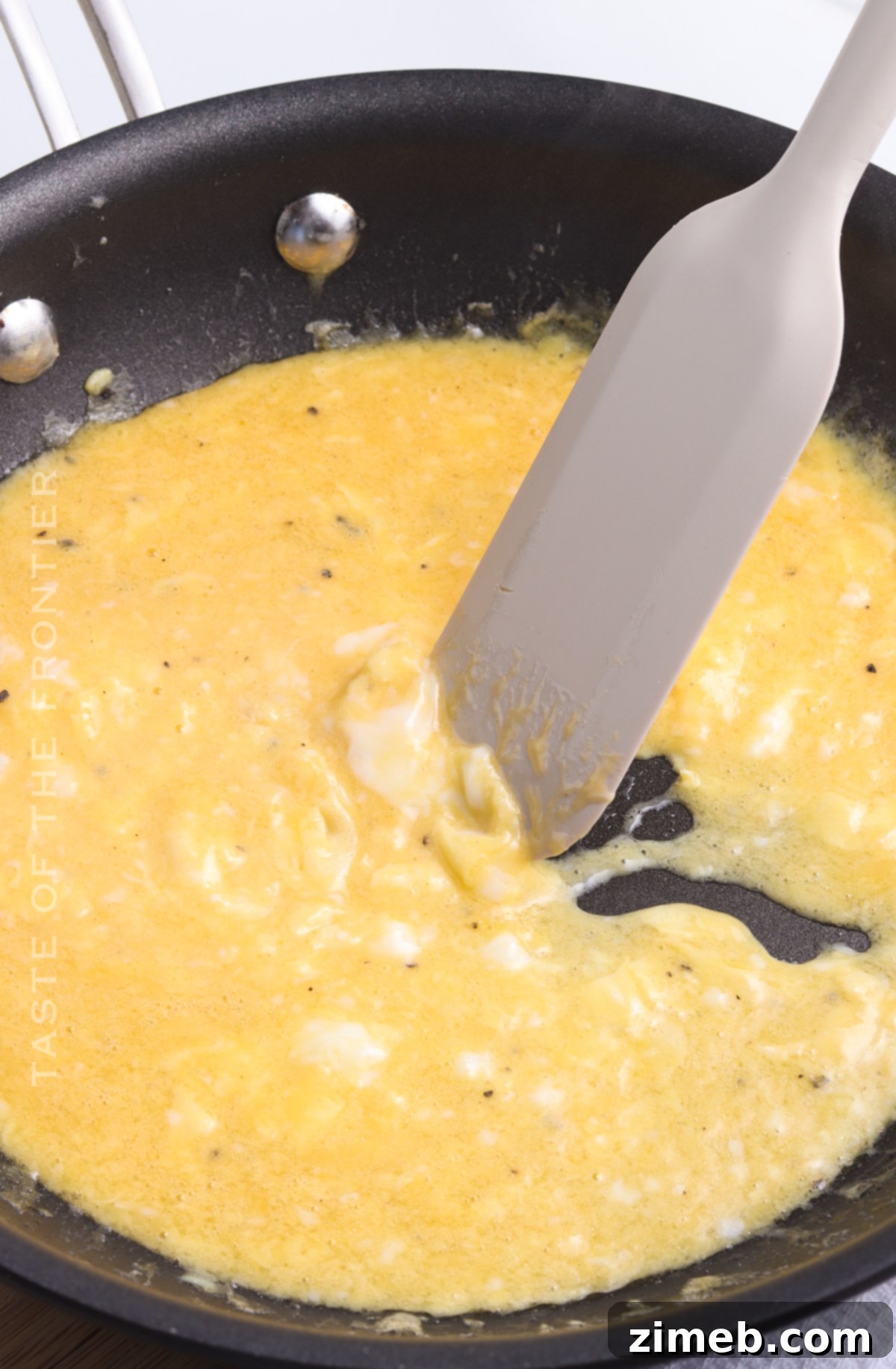 Perfect Scrambled Eggs 9 Close-up of Cheesy Scrambled Eggs in a Skillet